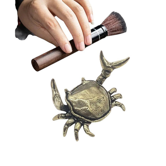 COMFORTH antique brass crab pen holder stand with detailed legs and shell, holding a makeup brush.