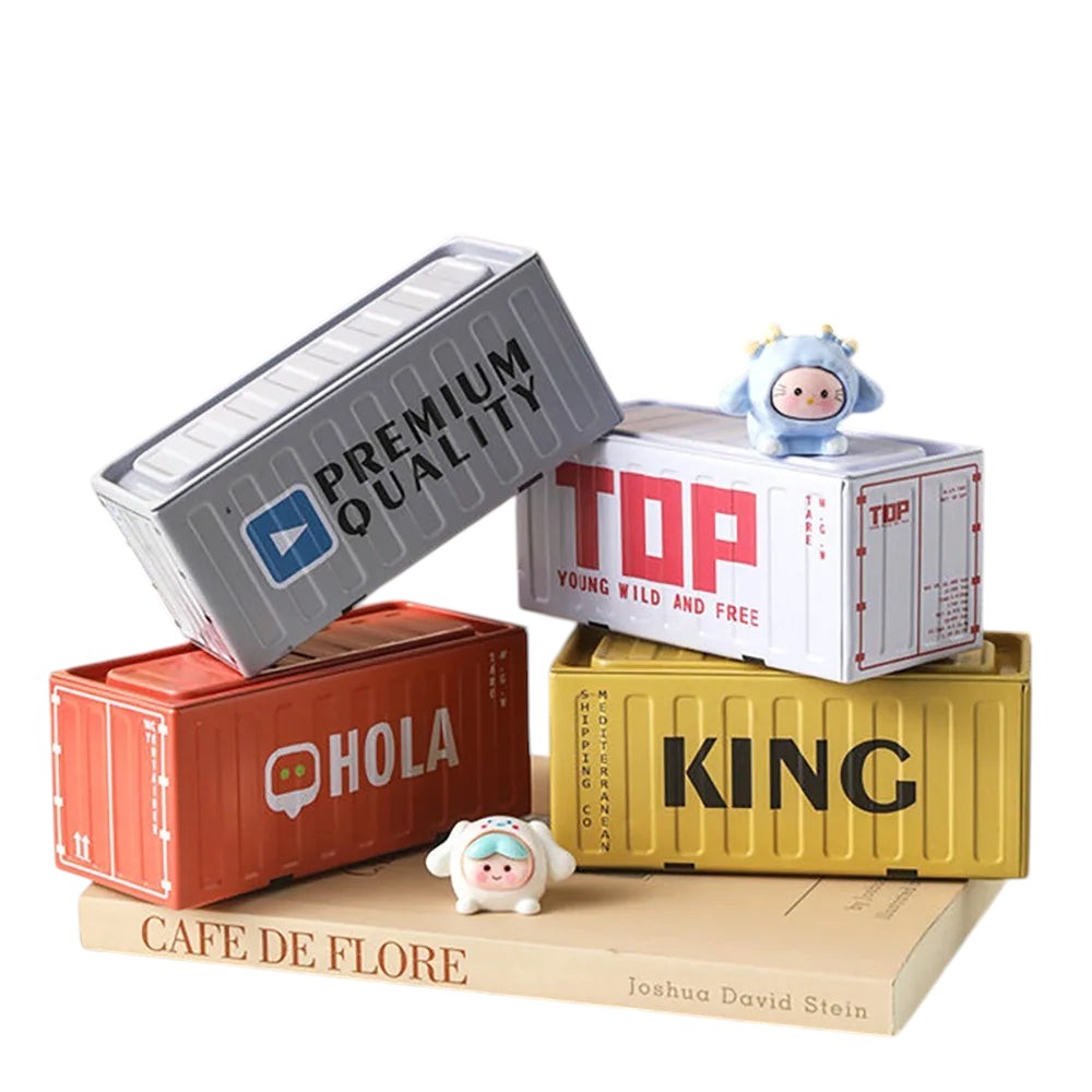COMFORTH decorative metal storage containers designed as shipping containers with playful figurines. Colors: orange, yellow, white, gray.