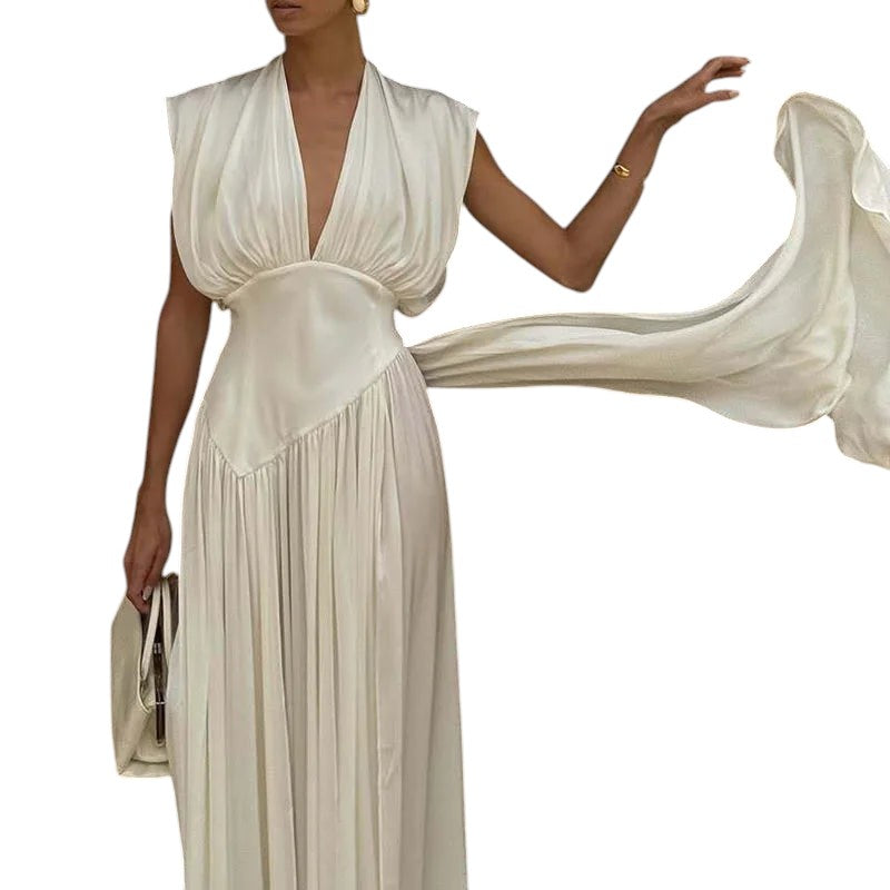 COMFORTH Elegant ivory sleeveless deep V-neck maxi dress with flowing fabric and gathered bodice.