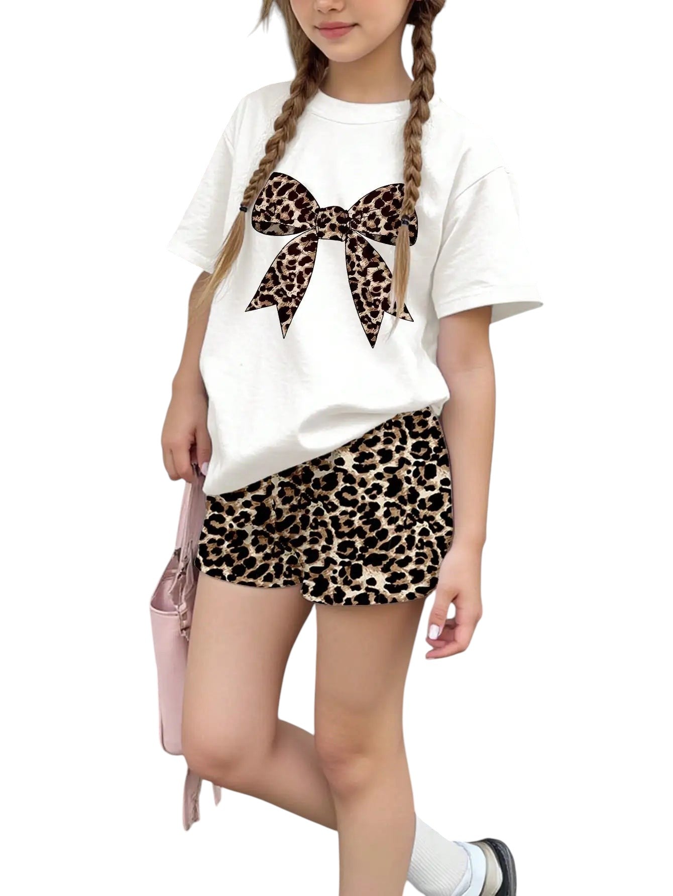 COMFORTH white t-shirt with leopard print bow graphic and matching leopard print shorts set for girls.