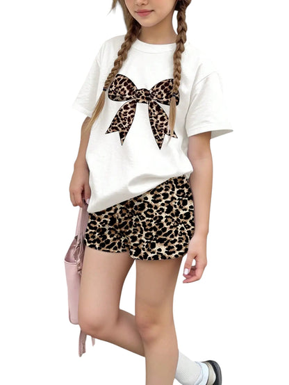 COMFORTH white t-shirt with leopard print bow graphic and matching leopard print shorts set for girls.