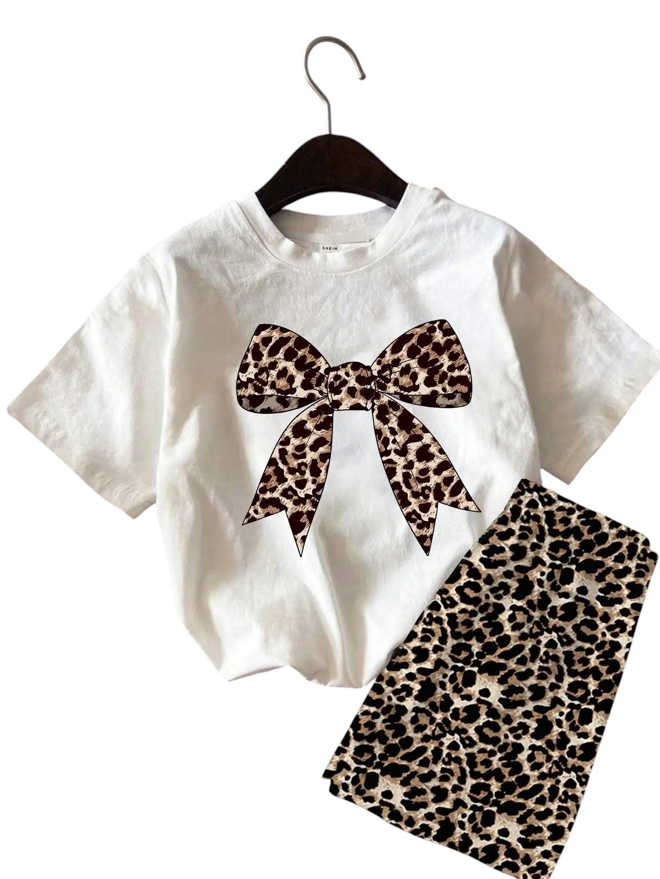 COMFORTH white cotton t-shirt with leopard print bow graphic and matching leopard print shorts set.