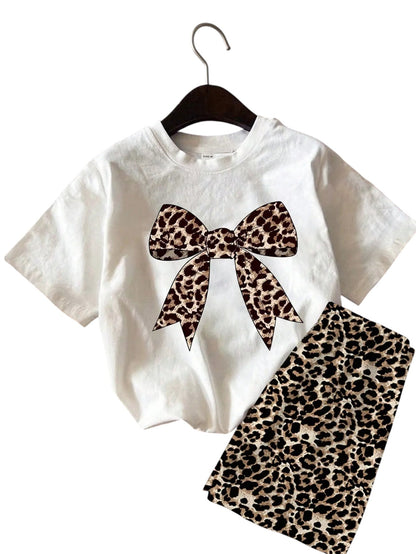 COMFORTH white cotton t-shirt with leopard print bow graphic and matching leopard print shorts set.
