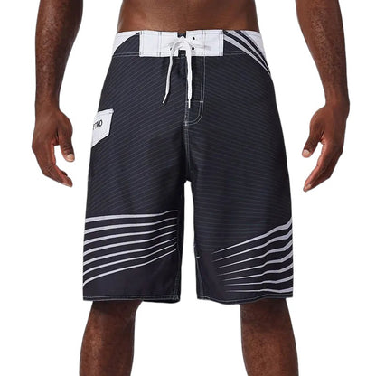 COMFORTH Men's black and white striped athletic board shorts with drawstring closure and side pocket.