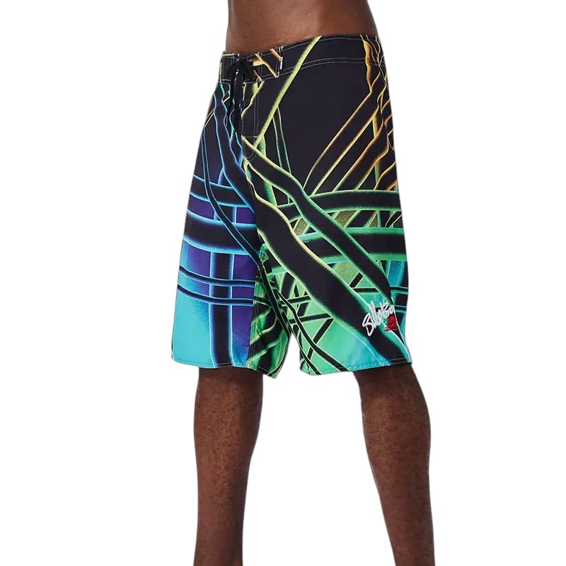 COMFORTH Men's athletic board shorts with abstract geometric print in black, blue, green, and yellow.