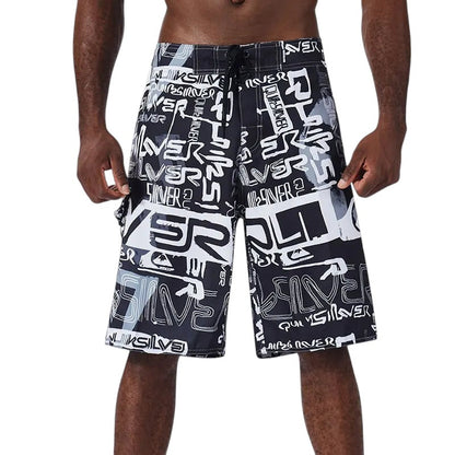 COMFORTH Men's black and white graphic print board shorts with drawstring closure.