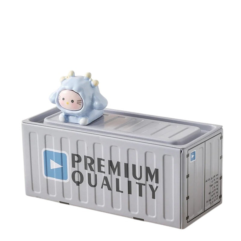 COMFORTH gray metal shipping container pen holder with a cute blue cartoon character on top.