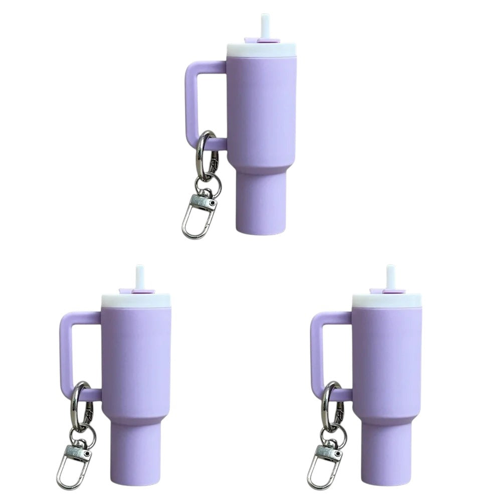 COMFORTH Mini tumbler keychain with handle and straw in light purple. Features a white lid and a silver keyring.