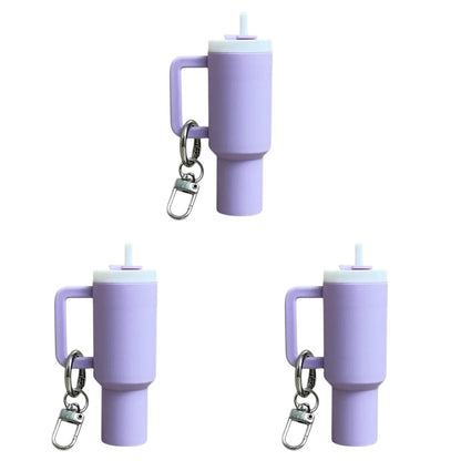 COMFORTH Mini tumbler keychain with handle and straw in light purple. Features a white lid and a silver keyring.