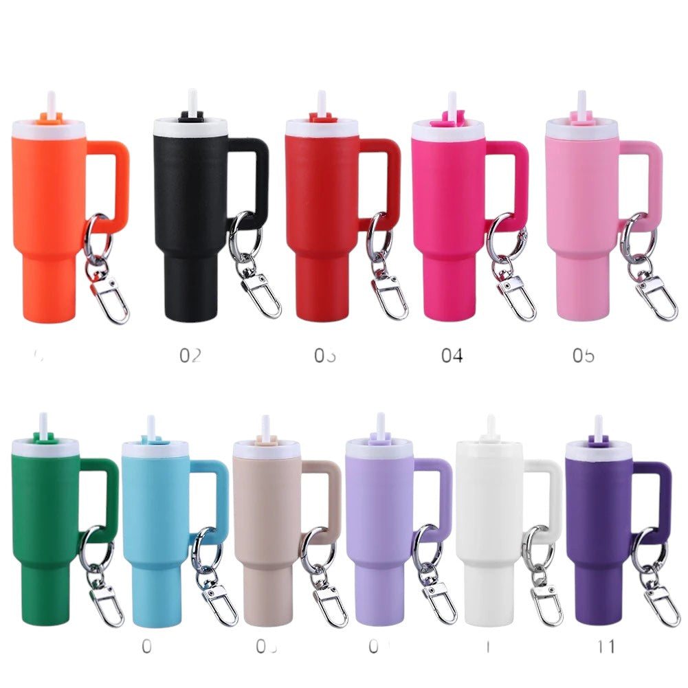 COMFORTH Mini tumbler keychain with handle and straw, available in multiple vibrant colors like orange, black, red, pink, green, blue, and purple.