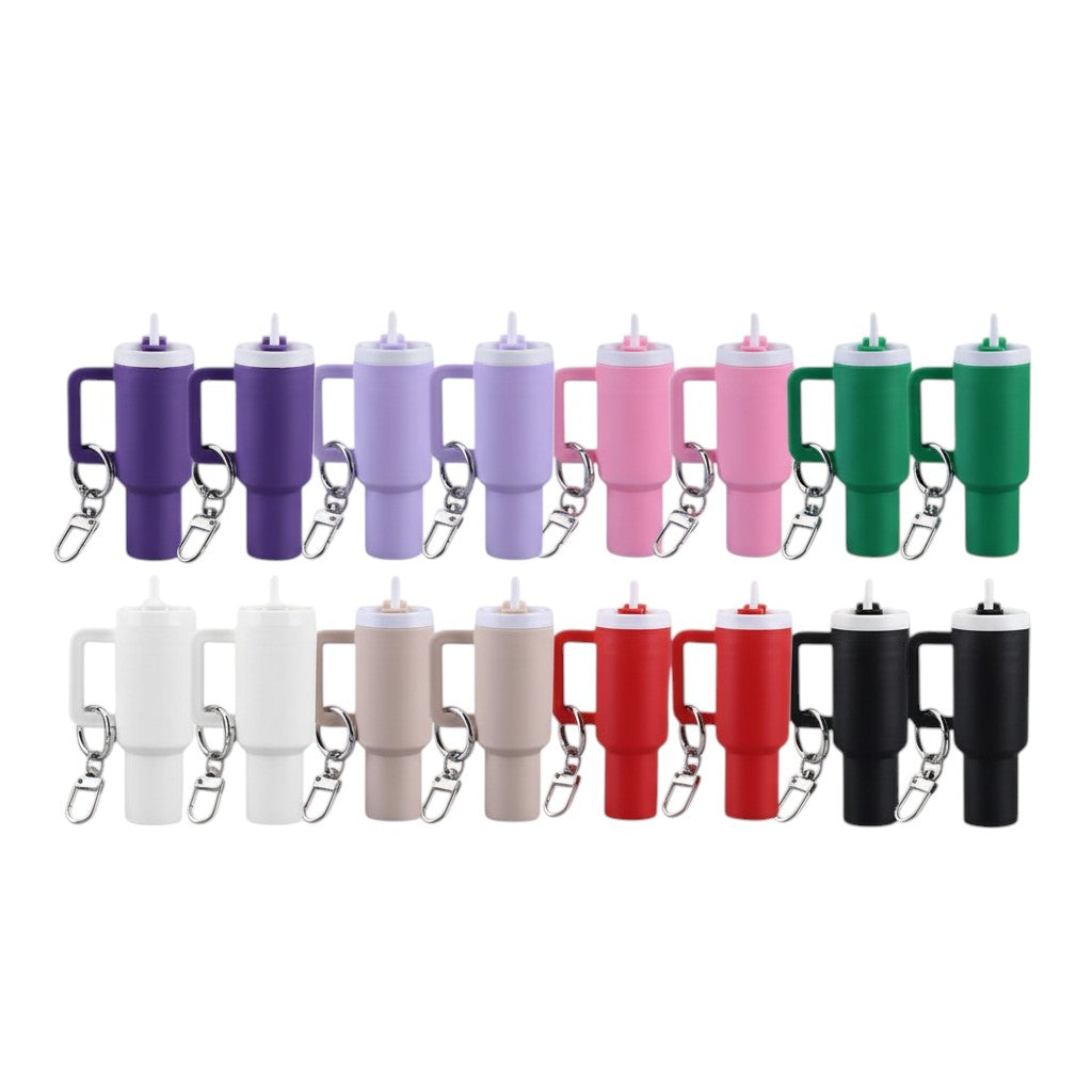 COMFORTH Mini tumbler keychain with handle and straw, available in purple, lavender, pink, green, white, beige, red, and black.