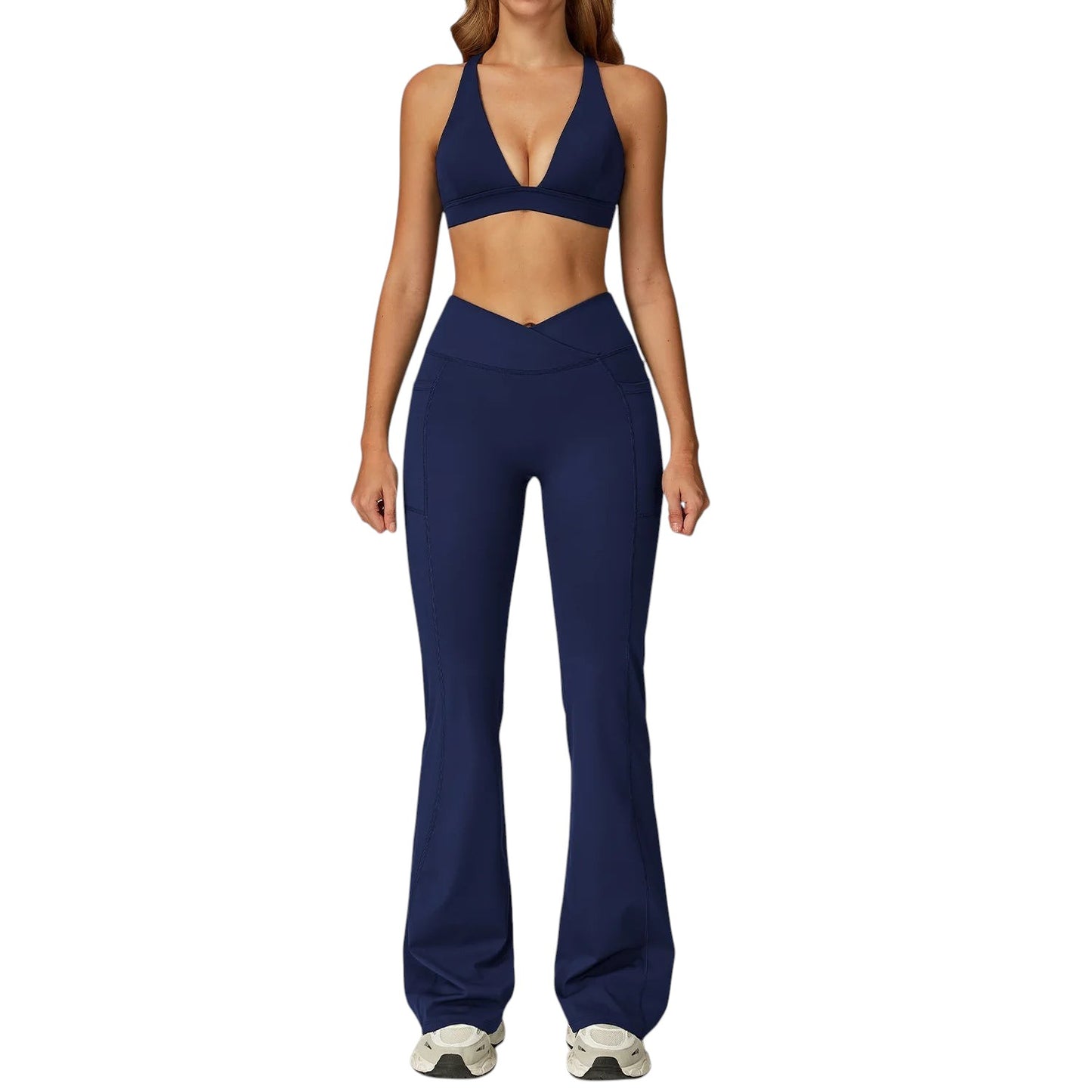 COMFORTH Women's navy blue athletic two-piece set with halter neck sports bra and V-waist flare leggings.