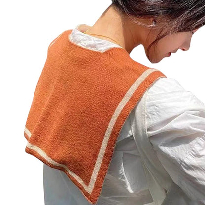 COMFORTH orange knit sailor collar with cream trim, worn as a detachable accessory over a white blouse.
