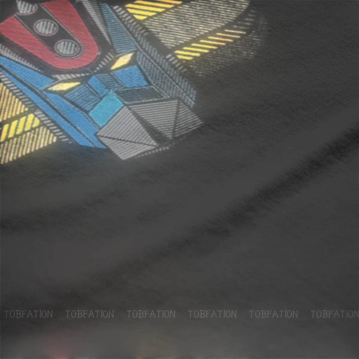 COMFORTH black cotton t-shirt with a retro robot head graphic in blue, red, and yellow.