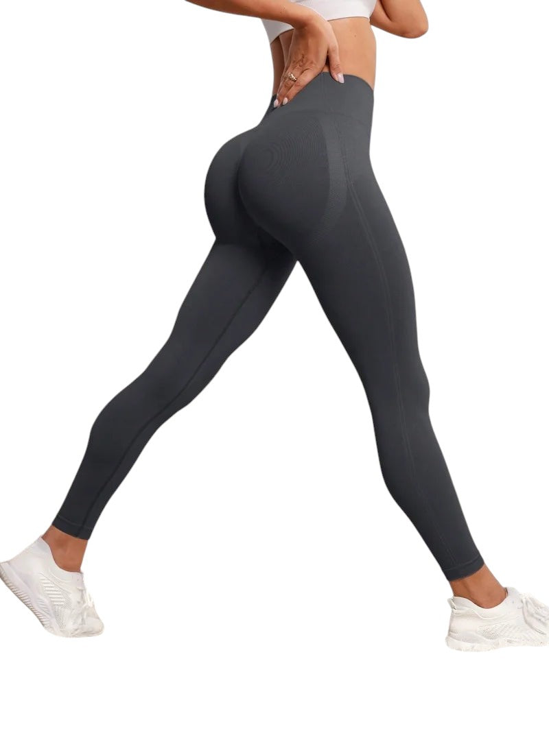COMFORTH seamless high-waisted dark grey workout leggings with textured detail and flattering silhouette.