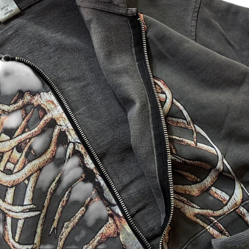 COMFORTH charcoal grey zip-up hoodie with distressed skeleton graphic on cotton blend fabric.