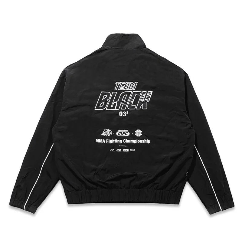 COMFORTH black MMA Fighting Championship track jacket with white piping and bold "TEAM BLACK" graphic on back.