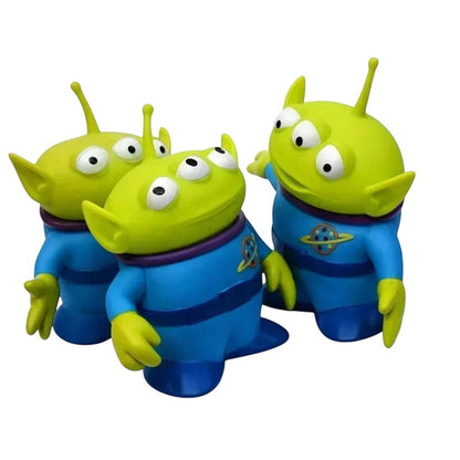 COMFORTH Toy Story Alien Figure Set, three green aliens with three eyes and blue uniforms, perfect for play and display.