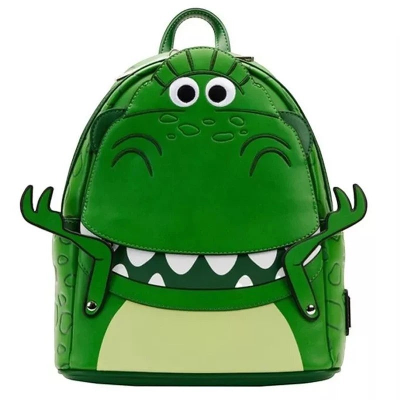 COMFORTH Toy Story Rex Dinosaur backpack in green faux leather with googly eyes and outstretched arms.
