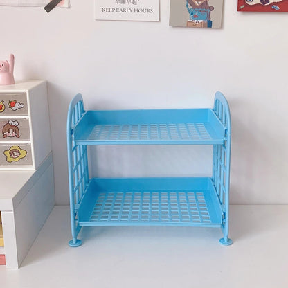 COMFORTH Two Tier Desk Organizer Shelf in light blue plastic with a bed-frame inspired design.