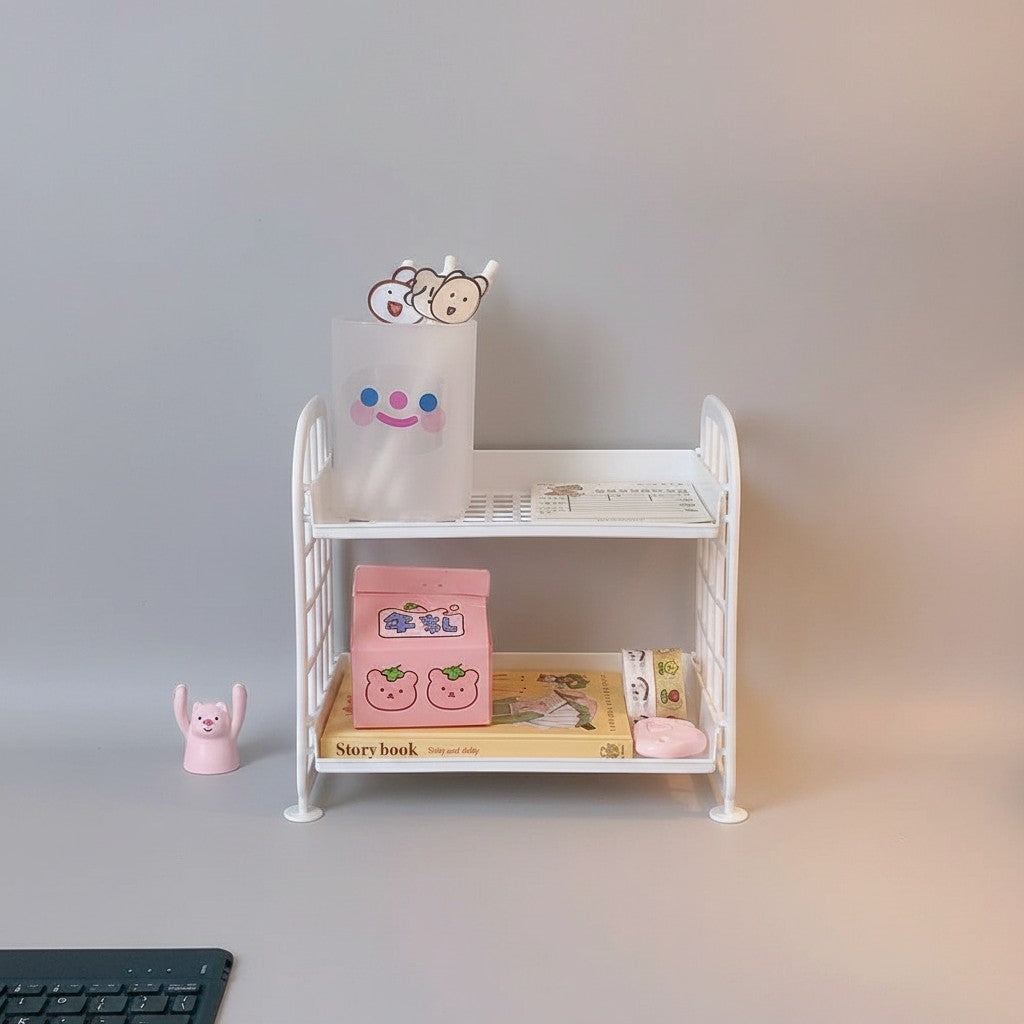 COMFORTH white plastic two-tier desk organizer shelf with bed frame design, holding stationery and trinkets.