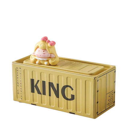 COMFORTH decorative storage container shaped like a yellow shipping container with a cute figurine on top.