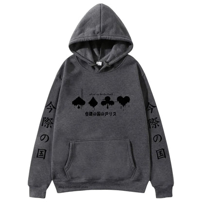 COMFORTHere Alice in Borderland graphic hoodie in dark grey with card suit symbols and Japanese text. Features a drawstring hood and front pocket.