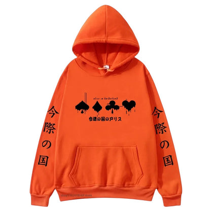 COMFORTHere orange graphic hoodie with "Alice in Borderland" card suit drip design and Japanese text. Relaxed fit, drawstring hood, front pocket.