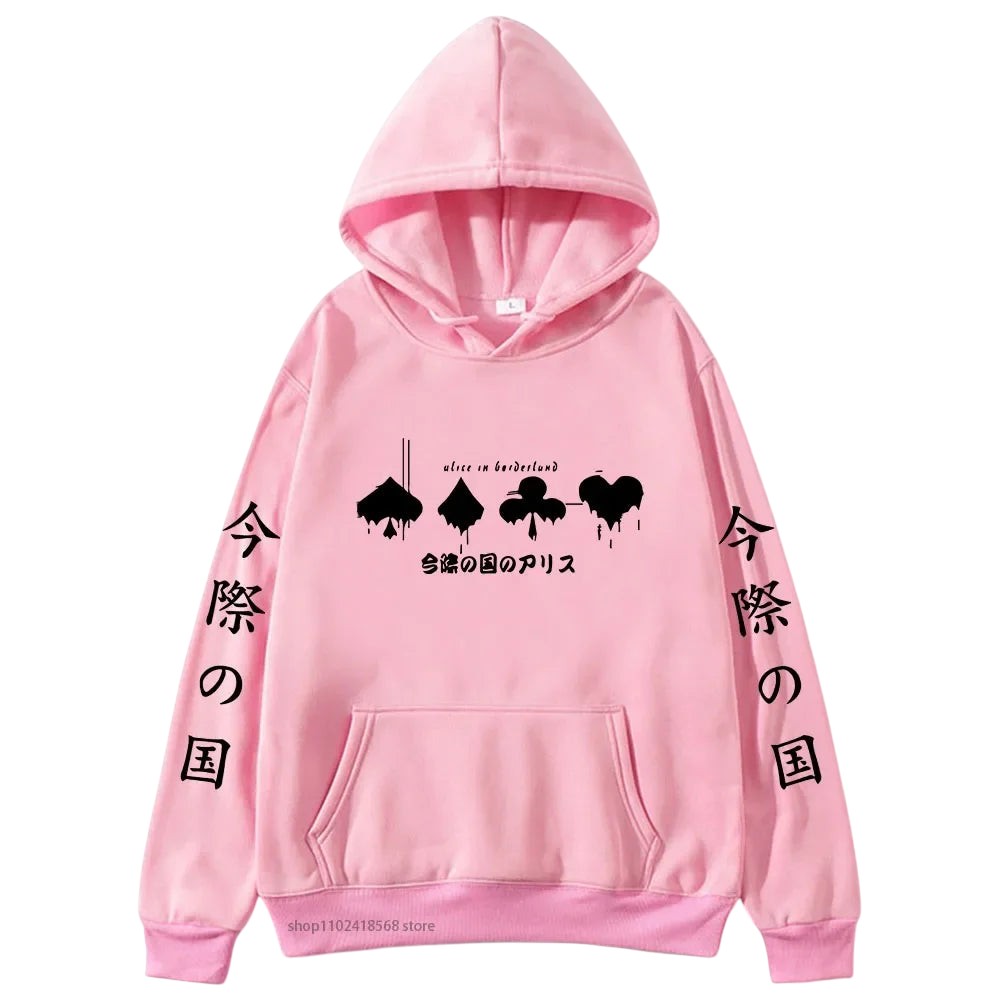 COMFORTHere Alice In Borderland graphic hoodie in pink with card suit symbols and Japanese text. Features drawstring hood and front pocket.