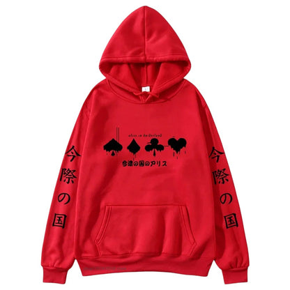 COMFORTHere red graphic hoodie with "Alice in Borderland" card suit symbols and Japanese text. Relaxed fit, drawstring hood, front pocket.