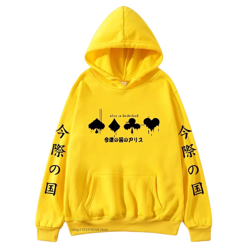COMFORTHere Alice In Borderland graphic hoodie in yellow, featuring card suit symbols and Japanese text. Made from a soft fabric blend.
