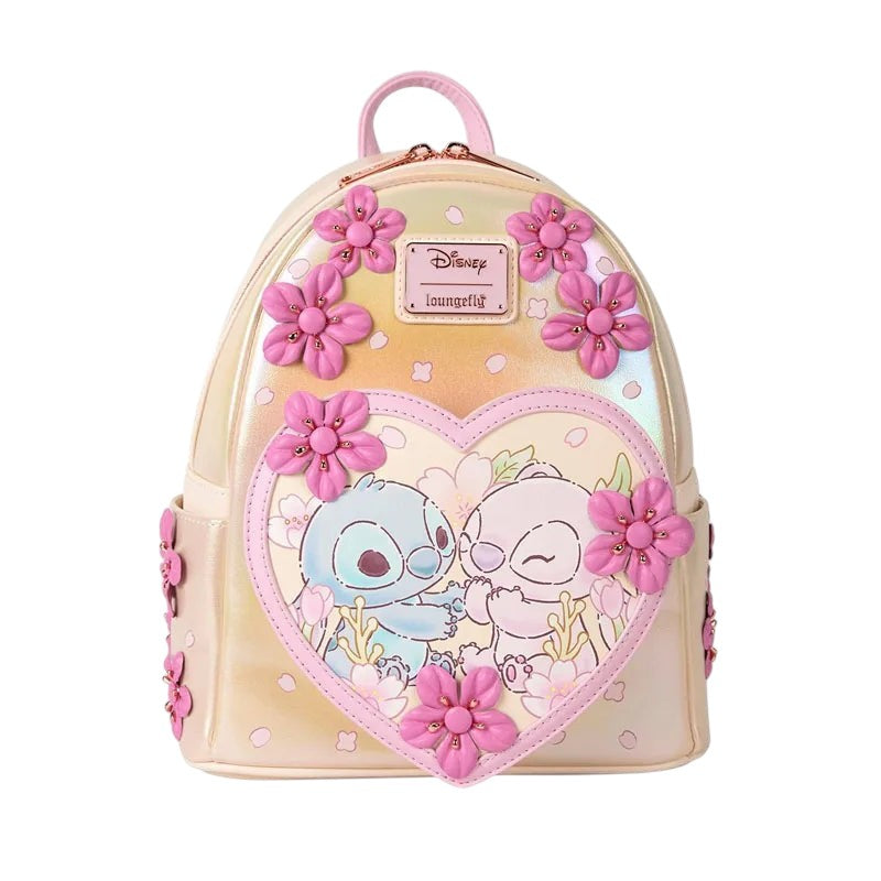 COMFORTHere Disney Pixar Stitch and Angel mini backpack with pink cherry blossoms and heart graphic. Iridescent pastel yellow.