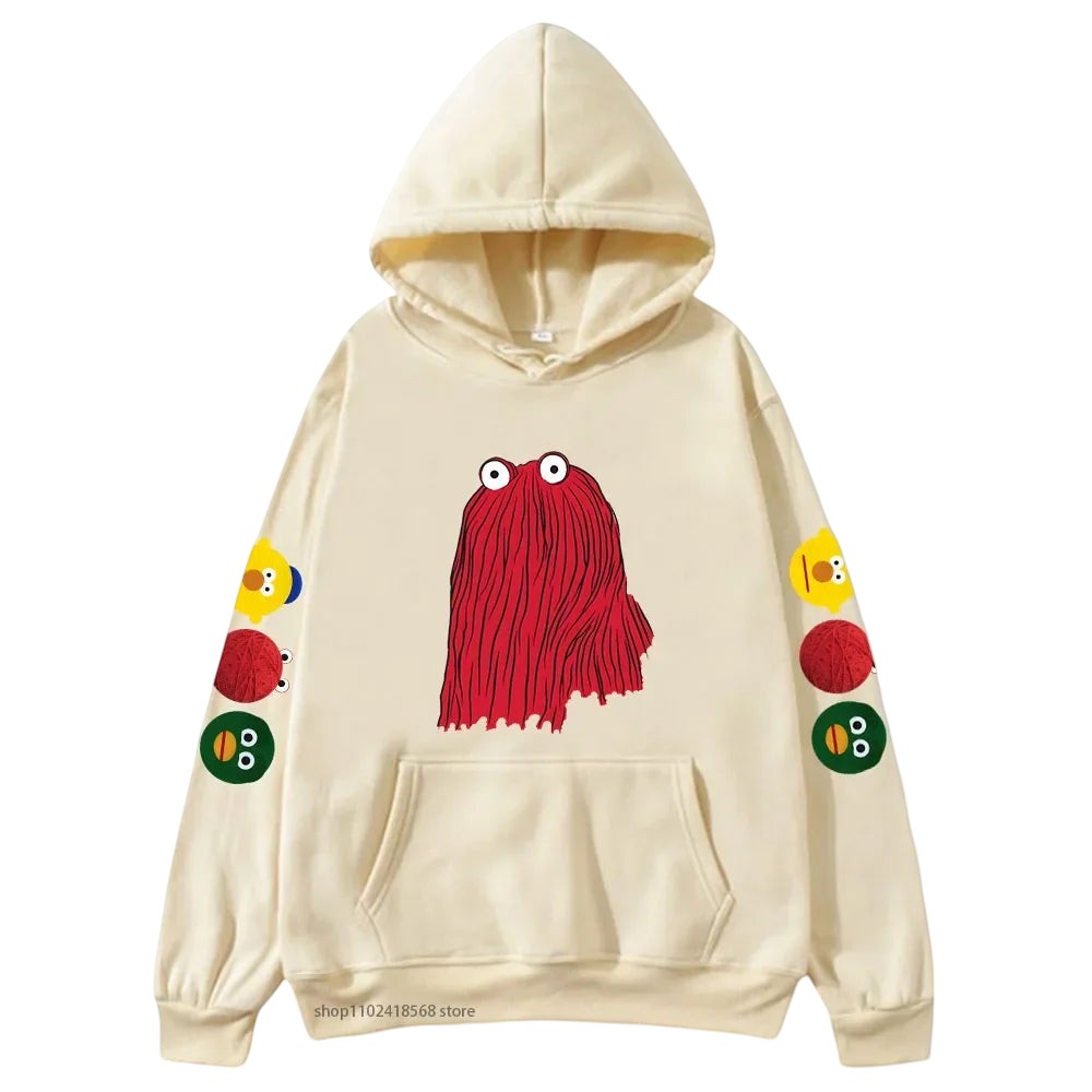 COMFORTHere cream graphic hoodie with red character on front and character icons on sleeve. Soft fabric.