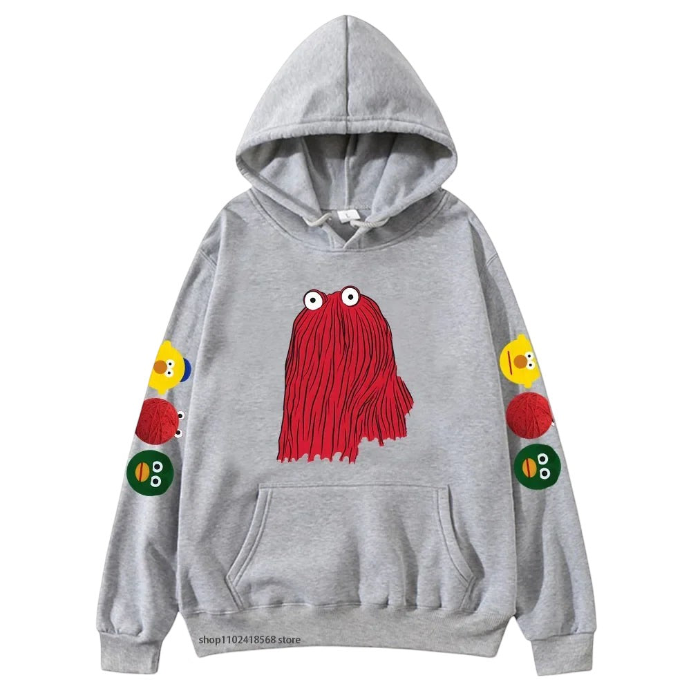 COMFORTHere grey graphic hoodie with a red character on the front and colorful character icons on the sleeves.