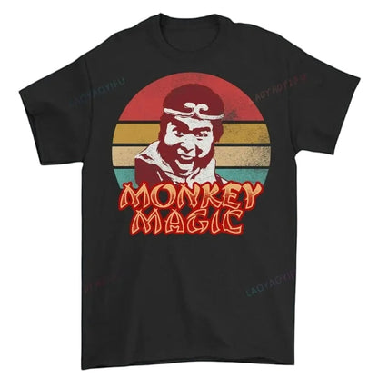 COMFORTHere Monkey Magic graphic t-shirt with a retro distressed sunset background and bold lettering. Black cotton.