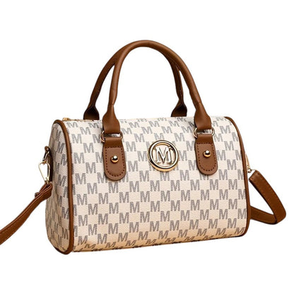COMFORTHere Monogram Barrel Handbag in white with all-over grey 'M' print and brown trim. Features top handles and a detachable shoulder strap.