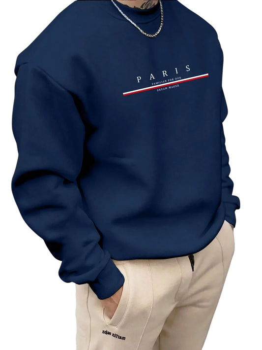 COMFORTHere navy blue crewneck sweatshirt with "PARIS" graphic design and red/white stripe detail.