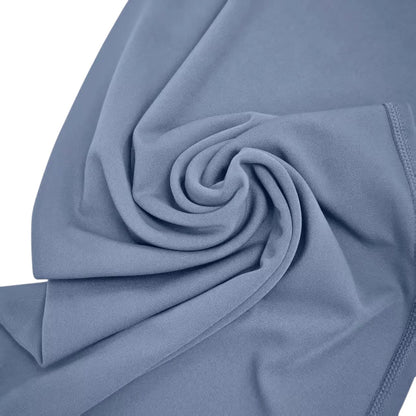 COMFORTHere NCLAGEN SoftMotion straight leg yoga pants in dusty blue, made of soft nylon fabric.