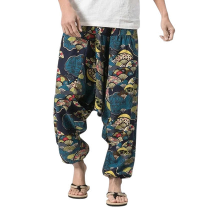COMFORTHere patterned loose fit harem pants with elastic waistband and cuffed ankles. Blue, green, yellow, and red fan pattern.
