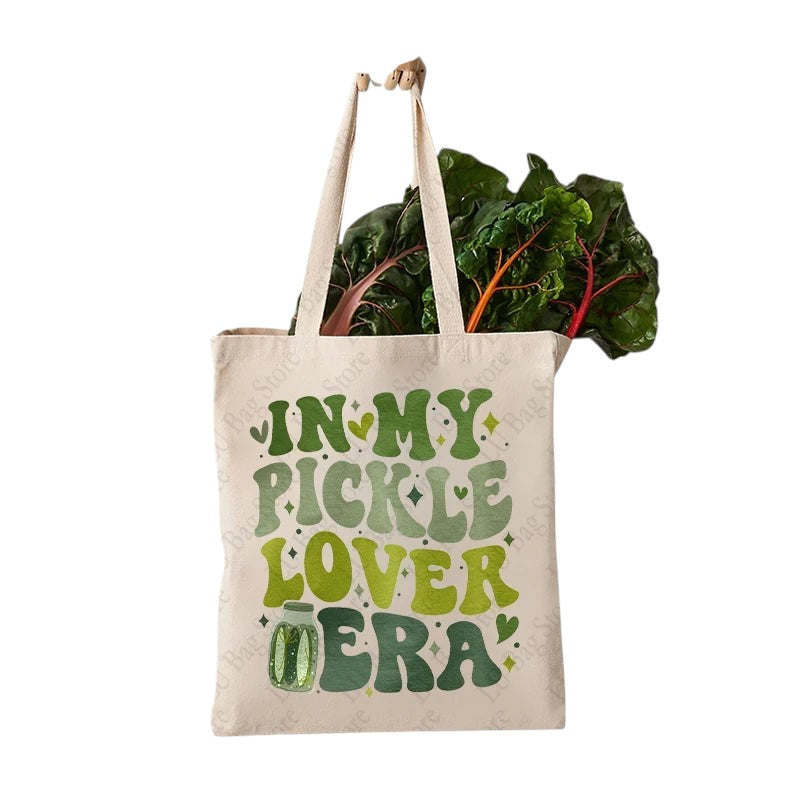 COMFORTHere canvas tote bag with "In My Pickle Lover Era" text in green shades and pickle jar graphic.