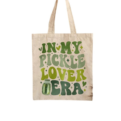 COMFORTHere canvas tote bag with "In My Pickle Lover Era" text in green retro font and pickle jar graphic.