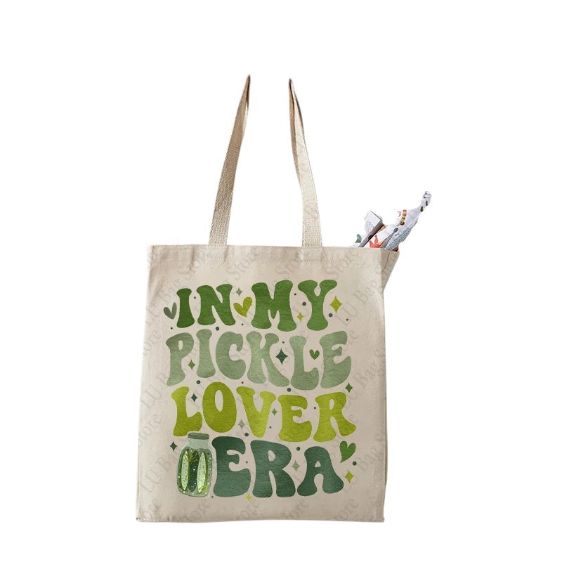 COMFORTHere canvas tote bag with "In My Pickle Lover Era" text in green retro font and pickle jar graphic.