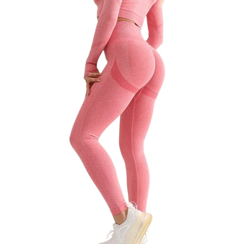 COMFORTHere pink seamless high-waisted workout leggings with textured detail and ribbed calves. Breathable fabric for ultimate comfort and performance.