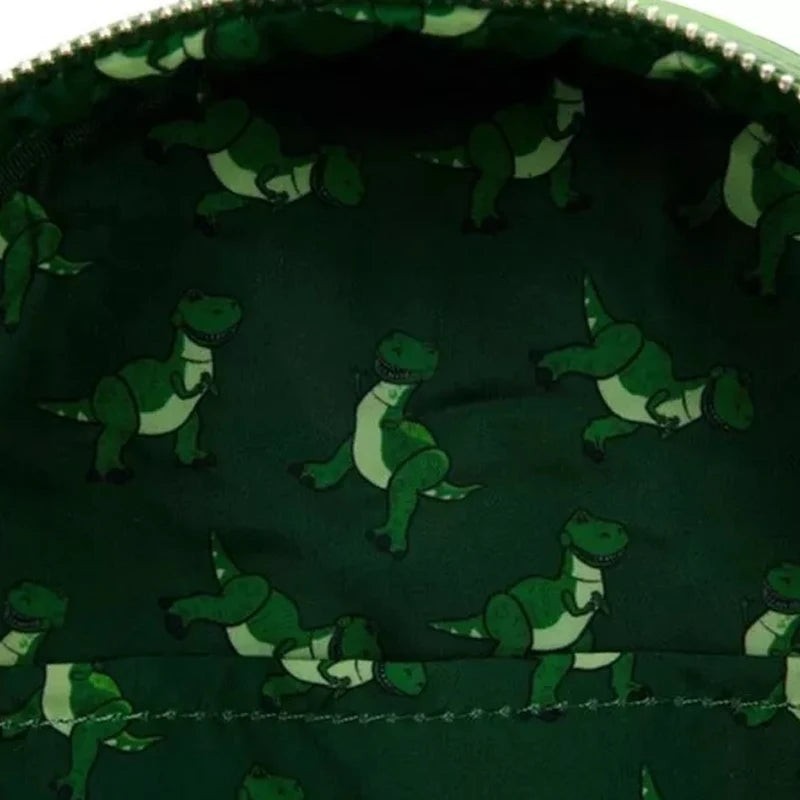 COMFORTHere green faux leather Toy Story Rex Dinosaur Backpack interior lining with all-over Rex print.