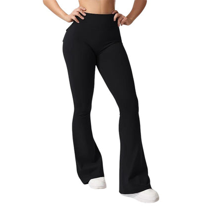 COMFORTHigh waisted black flare yoga pants with pockets and ruched back detail. Stretchy fabric.