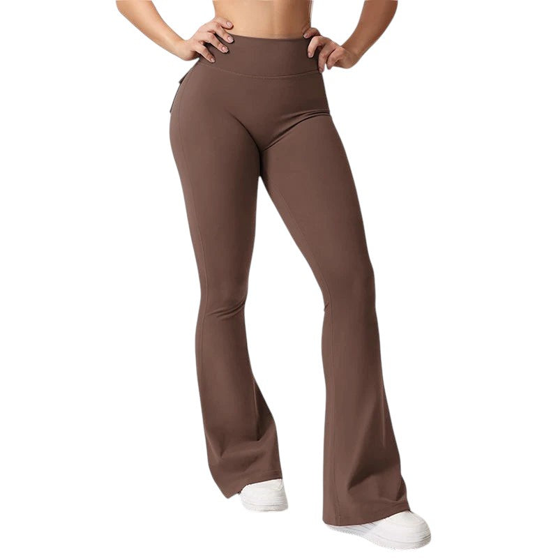 COMFORTHigh waisted brown flare yoga pants with pockets and ruched detailing on the back.