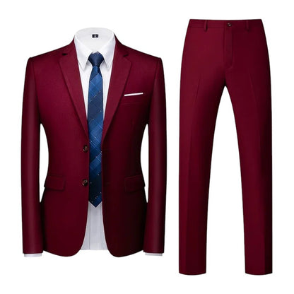 COMFORTS Men's two-piece burgundy suit set with notch lapel jacket and flat front trousers. Polyester-viscose blend.