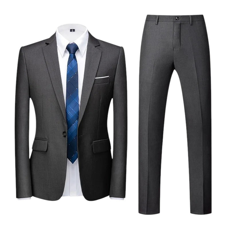 COMFORTS Men's dark grey two-piece suit set with notch lapel jacket and straight-leg trousers, paired with a blue patterned tie.